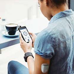 The FDA-approved Omnipod DASH system administers insulin and connects wirelessly to a smartphone via Bluetooth. 