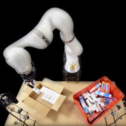 Kuka robotic arm, packing box, and bin with objects