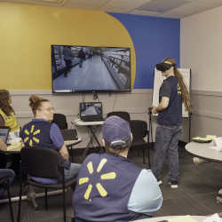 A Walmart employee goes through training in virtual reality.