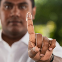 Anusha Withana with a piece of electronic skin on his finger