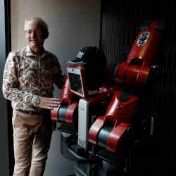 Walsh posing with a robot.