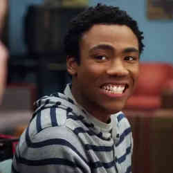 Donald Glover wears a fake smile.