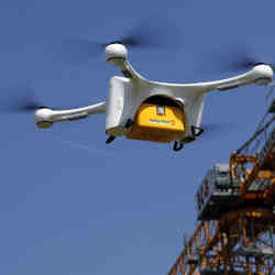 A drone carries a Swiss Post box containing laboratory samples during a trial flight. 