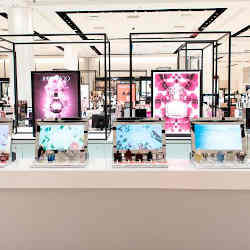 At Macy's new "digital fragrance bar," when customers pick up a perfume, a touchscreen lights up with information about the scent.