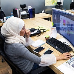 female coder at workstation