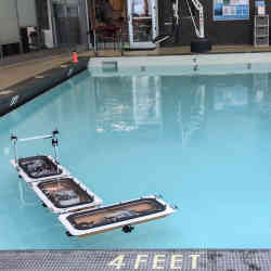 In experiments in a pool, the boats rearranged themselves from a connected straight line into an L shape.