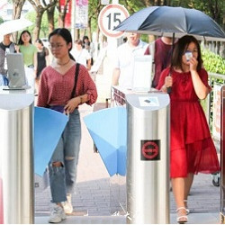 students at facial recognition turnstile at China Pharmaceutical University