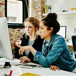 women at computer display