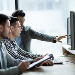 group of workers at computer