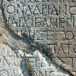 A Greek text inscription on a rock in Delphi.