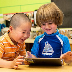 young schoolchildren with tablet