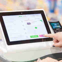 A touchscreen on the intelligent grocery carts allows customers to track and purchase food items.