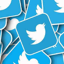 Multiple Twitter logos, representing tweets. 
