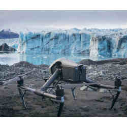 A drone in front of a glacier.