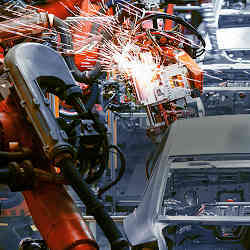 Robots working on an automotive assembly line.