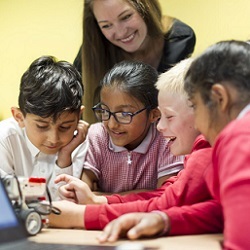 school boys and girls at a computer