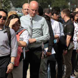  Job seekers wait in line outside a career fair.