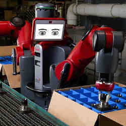 A robot packs a box on the assembly line.