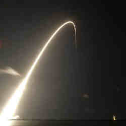 A SpaceX rocket carrying 60 satellites lifts off. 