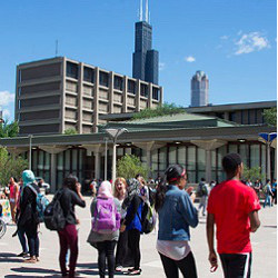 students on UIC campus with Willis Tower in background