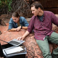 NAU's Helen Eifert and Mark Salvatore reading from laptop computer