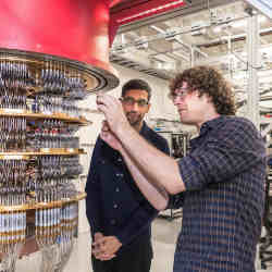 Alphabet CEO Sundar Pichai, left, and researcher Daniel Sank with a Google quantum computer.