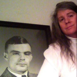 Julia Schwinghamer with photo of Alan Turing