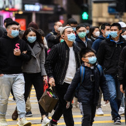 Chinese pedestrians wearing flu masks