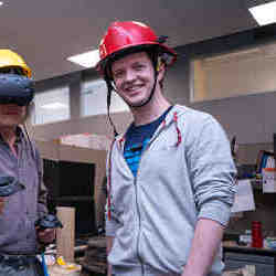 A researchers in the Haptic Helmet prototype.