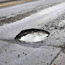 A pothole in a Boston street.