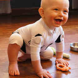 A baby wears the smart jumpsuit.