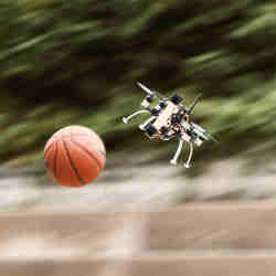 The quadcopter dodges the basketball.