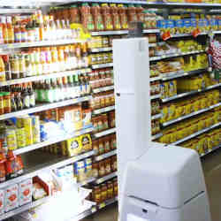 An inventory robot scans Walmart shelves.