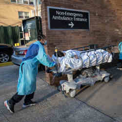 A coronavirus patient being rolled into Montefiore Medical Center in the Bronx, New York City, on Monday. 