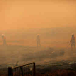 Members of the New South Wales Rural Fire Service extinguishing a fire north of Bredbo, Australia, in February.