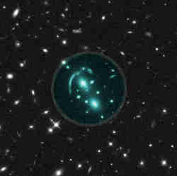 A Hubble Space Telescope image of a gravitational lens (center).