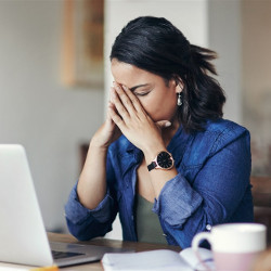 stressed stay-at-home worker at laptop