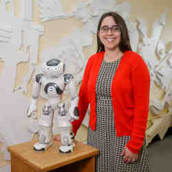 Oregon State University's Naomi Fitter, with the robot comedian.