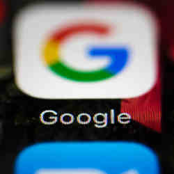 The Google app icon on a smartphone handset.
