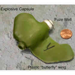 Rendering of an inert PFM-1 plastic landmine (butterfly mine) with a U.S. coin for scale.