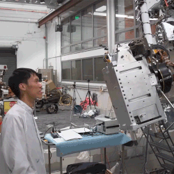  JPL engineers monitor testing of the Perseverance rover's Sample Caching System. 