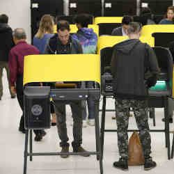 People use new voting machines in Los Angeles during the March 3 primary.