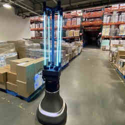 The robot disinfects a stockroom.