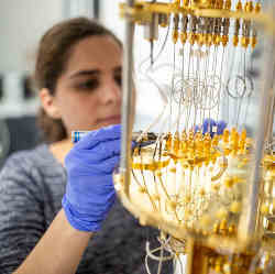 Former postdoctoral fellow Audrey Bienfait works on the quantum hardware. 