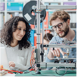 female and male student in science lab