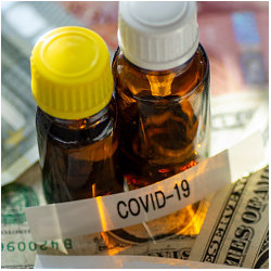 currency and vials with COVID-19 label