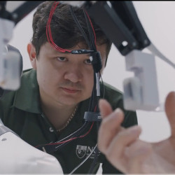 NUS team member watching the robotic system