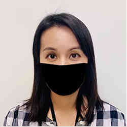 A young woman wearing a face mask.