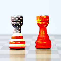 chess pieces showing U.S. flag, China flag