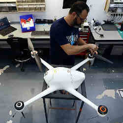 An Airobotics employee works on one of the drones at their offices in Israel.